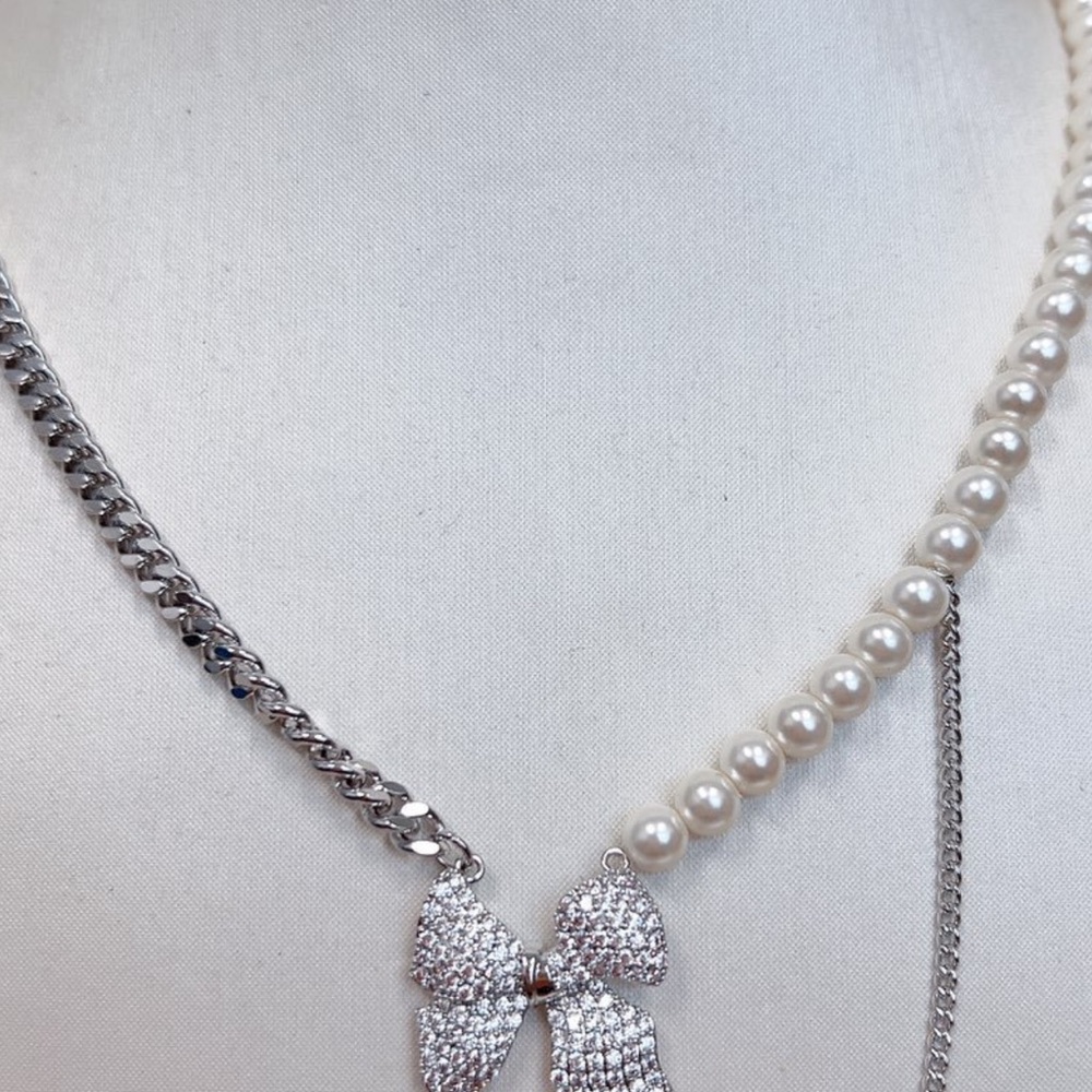 Elegant Silver and Pearl Bow Necklace